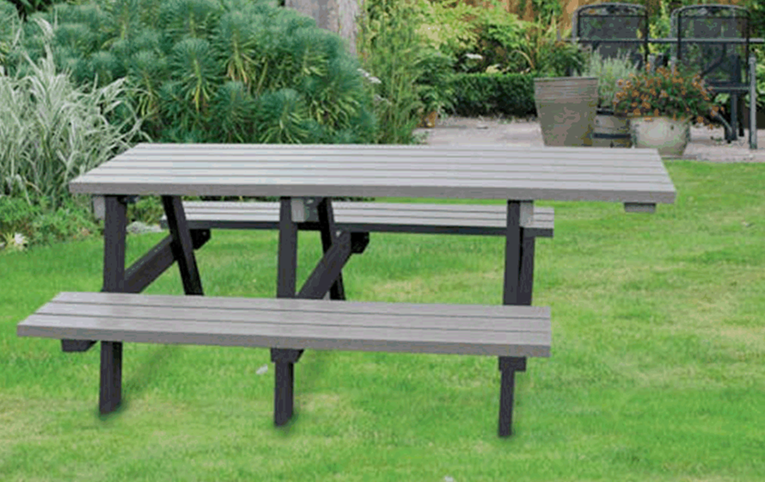 A picnic table in a backyard

Description automatically generated with low confidence