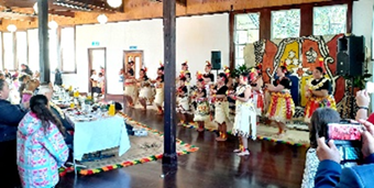 A group of people in traditional clothing

Description automatically generated