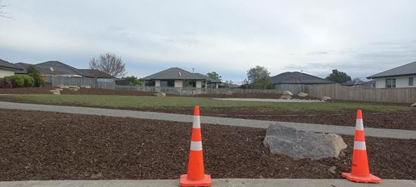 A cone in front of a house

Description automatically generated