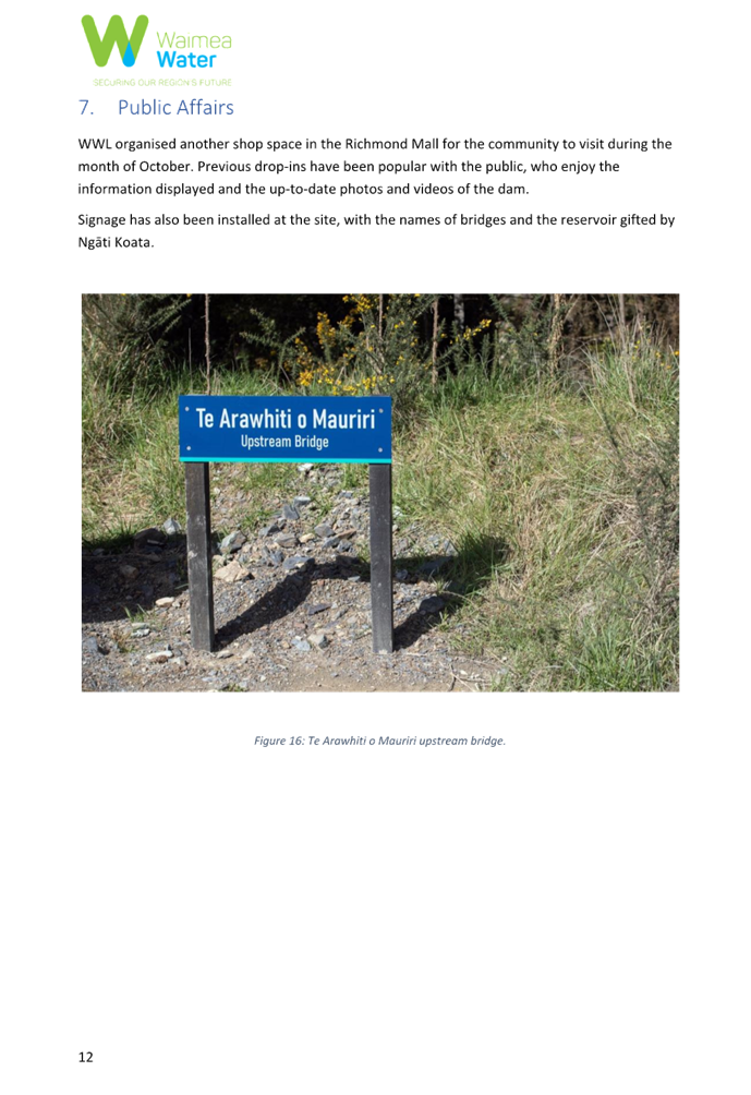 A blue sign on a gravel path

Description automatically generated