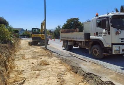 A construction vehicle on the road

Description automatically generated