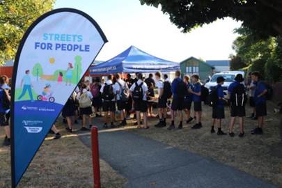 A group of people standing in a line

Description automatically generated