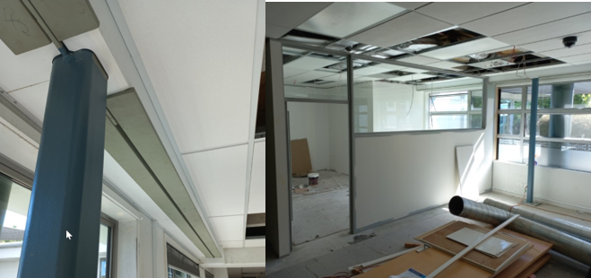 A room with a mirror and a wall

Description automatically generated with medium confidence