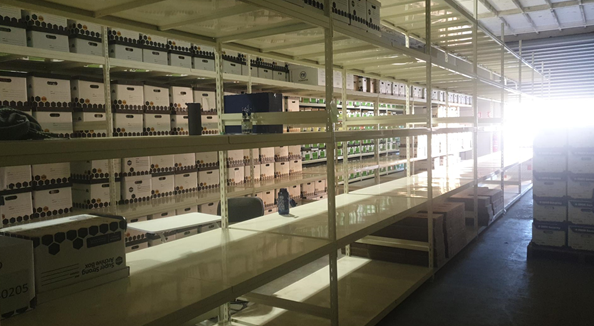 A room with shelves and shelves of boxes

Description automatically generated with medium confidence