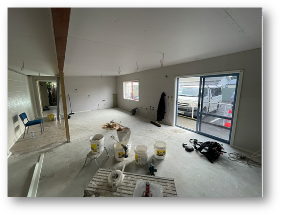 A room with buckets and buckets in it

Description automatically generated
