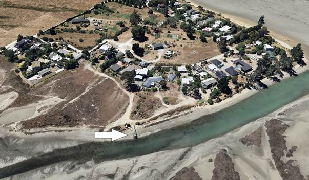 Aerial view of a river and a village

Description automatically generated