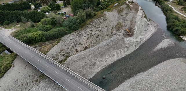 A road and water next to a river

AI-generated content may be incorrect.