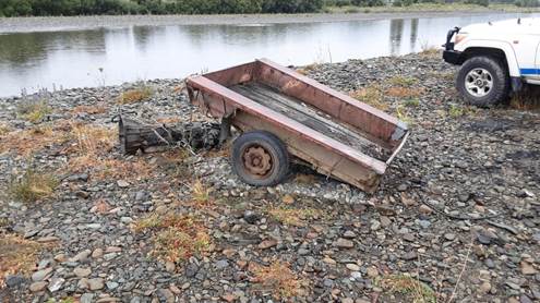 A rusty metal trailer on rocky shore

AI-generated content may be incorrect.