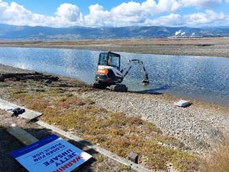 A construction vehicle in a body of water

AI-generated content may be incorrect.