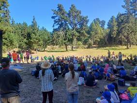 A group of people sitting in a circle

AI-generated content may be incorrect.