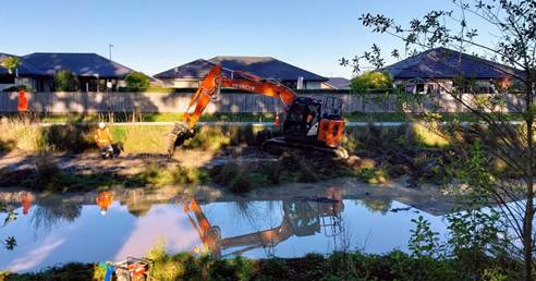 A construction vehicle in a yard

AI-generated content may be incorrect.
