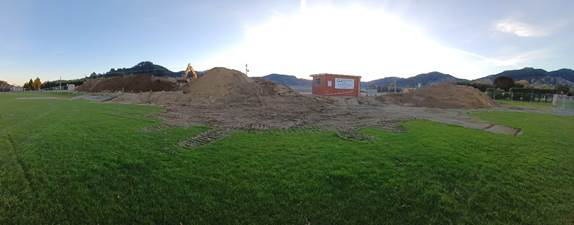A pile of dirt and dirt on a field

AI-generated content may be incorrect.