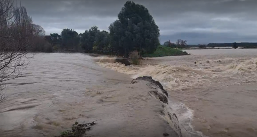 A river with water crashing into it

AI-generated content may be incorrect.