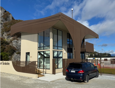 A building with a car parked outside

AI-generated content may be incorrect.